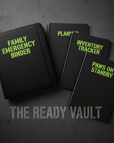 THE READY VAULT bundle — four black coil-bound preparedness books fanned out on dark concrete with phosphor green stencil titles