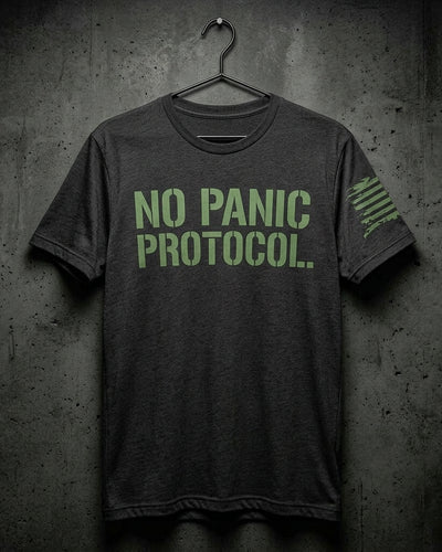 NO PANIC PROTOCOL tee in heather charcoal with phosphor green stencil front print and reverse-field tattered American flag on the sleeve